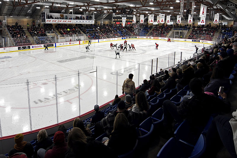 An oblique view of the ice surface and stadium seating during a men's hockey game